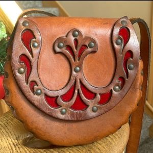 Vintage 70’s tooled genuine leather shoulder bag with red velvet inserts
